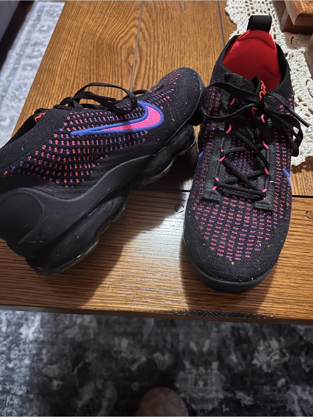 Nike Black Flyknit Sneakers with Pink and Blue Swoosh